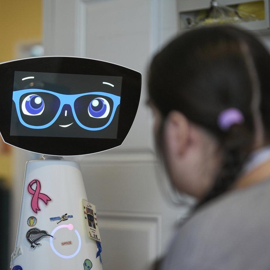 A robot programmed to act like a 7-year-old girl works to combat fear and loneliness in hospitals